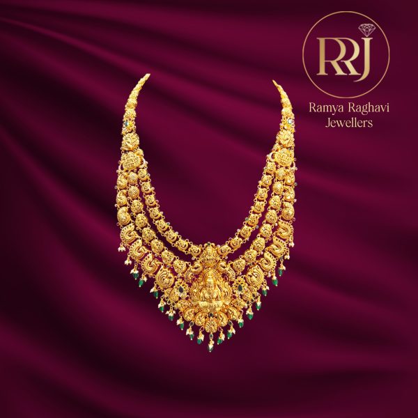 Three-layered Lakshmi gold haram with green bead drops